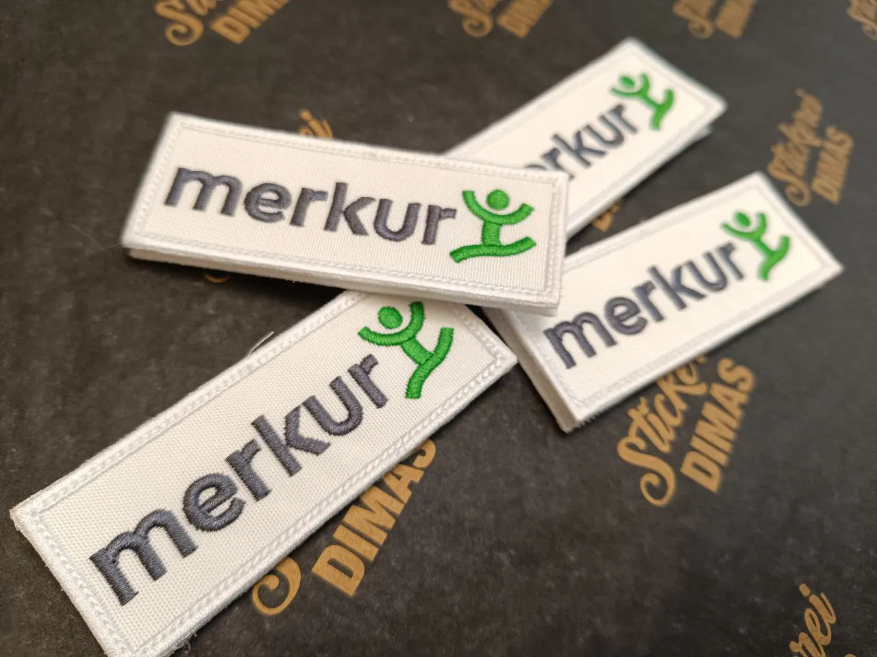 Merkur Versicherung gestickte Logo-Aufnäher weiß-grün