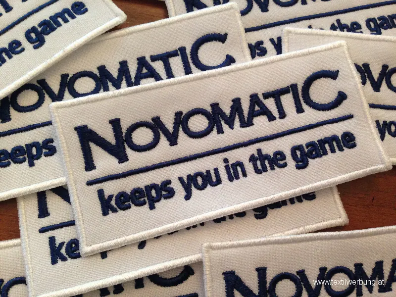 Novomatic Logo als gestickter Aufnäher